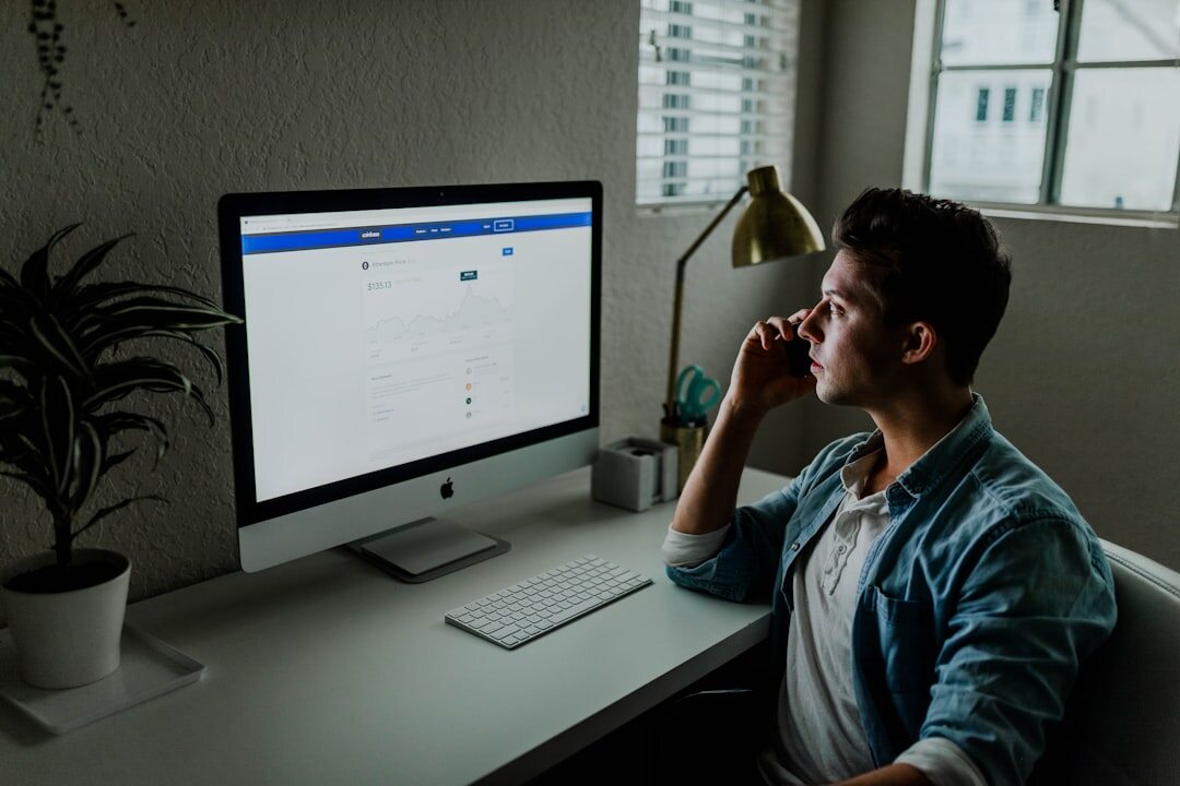 Belgian tech entrepreneur working on a laptop in a modern office